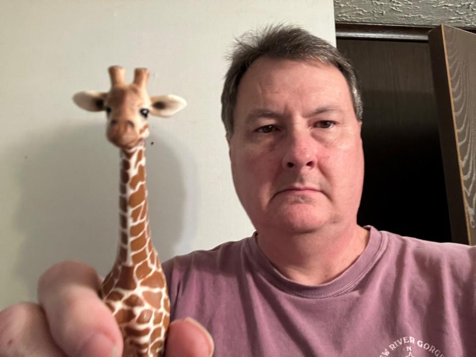 News Journal reporter Mark Caudill fell on a giraffe figurine, sustaining a broken rib in the process.