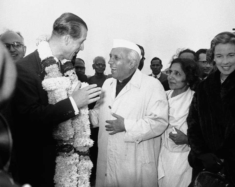 FILE - In this Jan. 21, 1959 file photo, India's Prime Minister Jawaharlal Nehru welcomes Britain's Prince Philip to New Delhi, India. The Prince is on the first stage of his round-the-world-tour and is scheduled to spend two weeks in India on the first stage of his 36,000-mile tour. Buckingham Palace says Prince Philip, husband of Queen Elizabeth II, has died aged 99. (AP Photo/File)