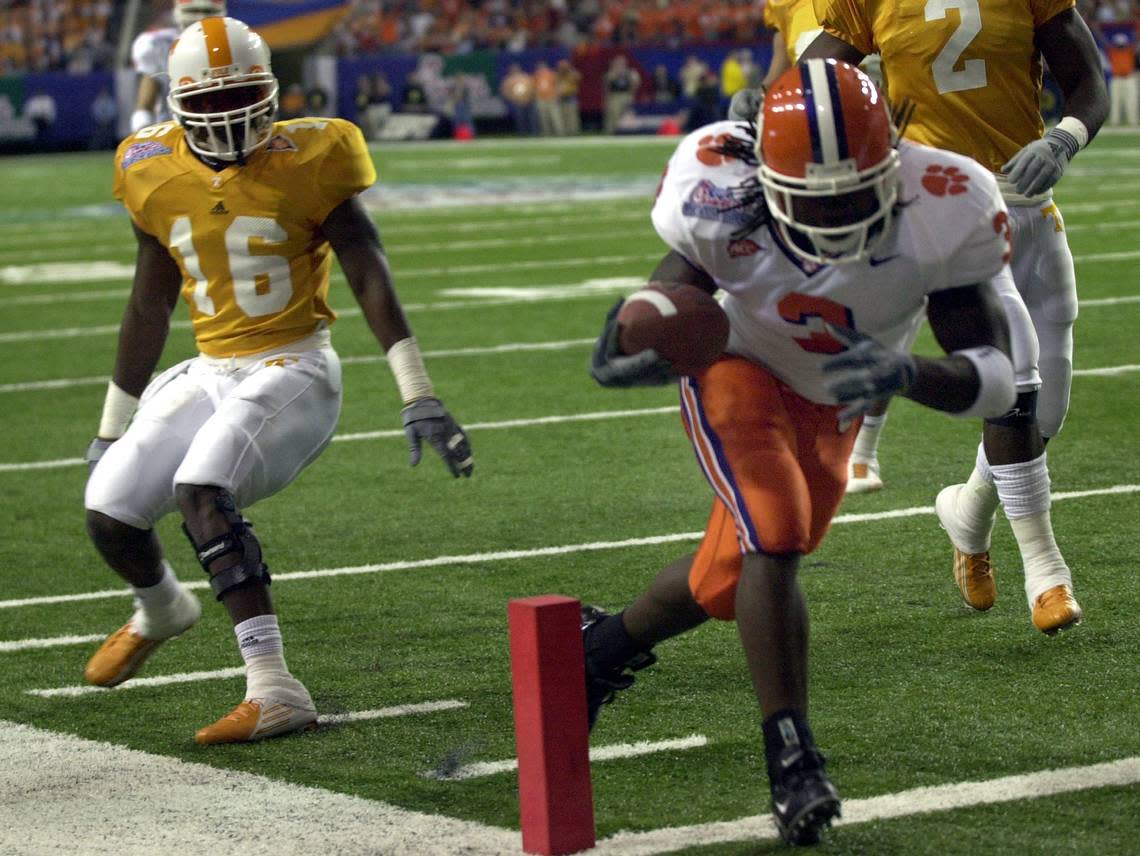 KRT SPORTS STORY SLUGGED: FBC-PEACHBOWL KRT PHOTO BY ERIK CAMPOS/THE STATE (January 2) ATLANTA, GA -- Clemson’s Duane Coleman gets across the goal line in front of Tennessee’s Rashad Baker (16) in the first half of the Peach Bowl on Friday, January 2, 2003. (gsb) 2004