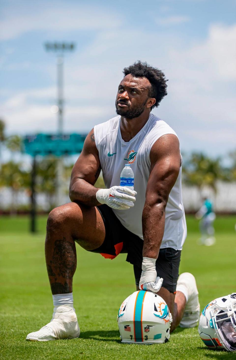 Miami Dolphins offensive lineman Austin Jackson rests after participating in team practice at the Baptist Health Training Complex on Tuesday, May 23, 2023, in Miami Gardens, Fla.