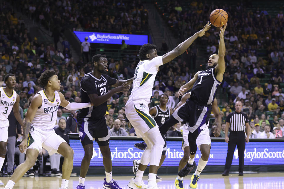 Kansas State guard Markquis Nowell (1) shoots to score over Baylor forward Josh Ojianwuna (15) in the first half of an NCAA college basketball game, Saturday, Jan. 7, 2023, in Waco, Texas. (AP Photo/Rod Aydelotte)