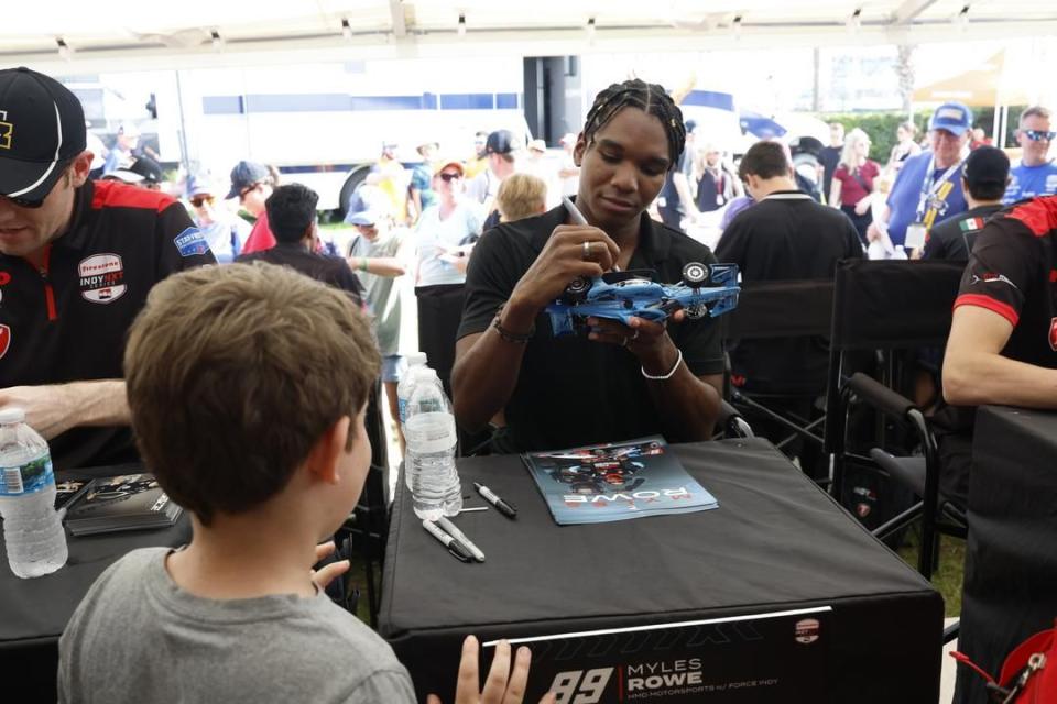 a person taking a picture of a boy with a camera