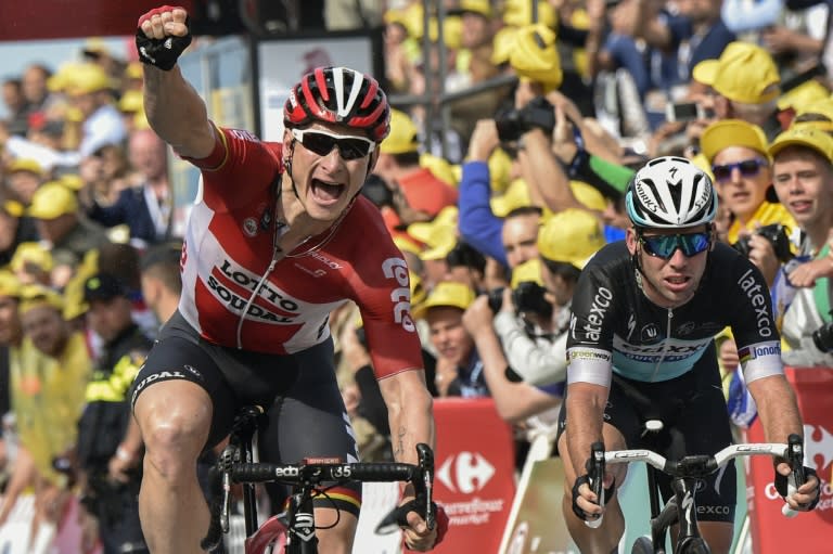 Germany's Andre Greipel (L) celebrates as he crosses the finish line ahead of Britain's Mark Cavendish at the end of the second stage of the Tour de France between Utrecht and Vrouwenpolder, The Netherlands on July 5, 2015