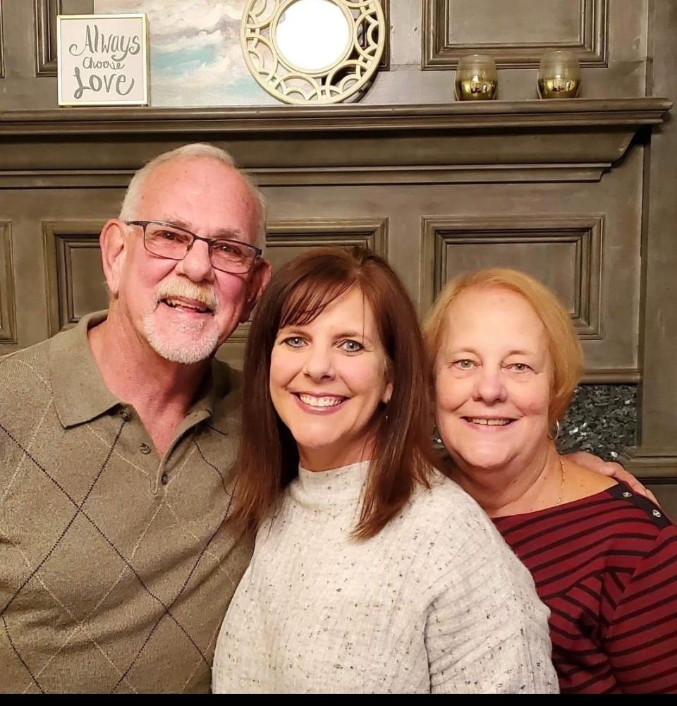 Joe and Donna Cougill with their daughter, Laura Mabry (center), who the Cougills say is responsible for reuniting them, leading to their marriage.