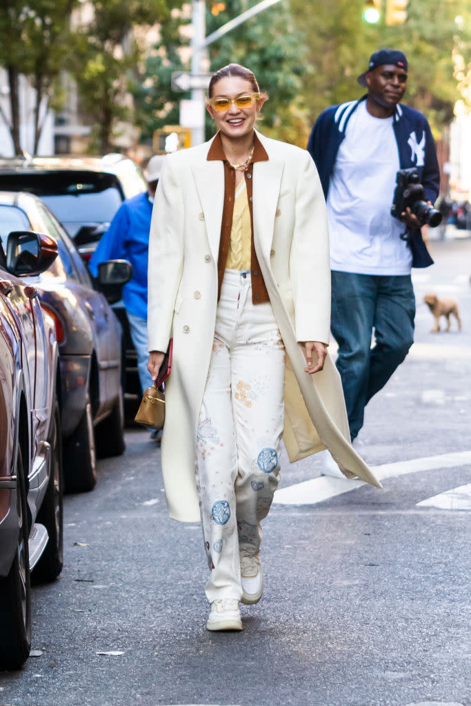 Gigi Hadid strolled through New York City in Reformation printed jeans. (Photo by Gotham/GC Images)