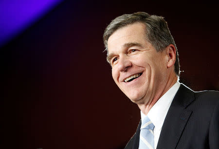 FILE PHOTO -- North Carolina Governor-elect Roy Cooper speaks to supporters at a victory rally the day after his Republican opponent and incumbent Pat McCrory conceded in Raleigh, North Carolina, U.S., December 6, 2016. REUTERS/Jonathan Drake/File Photo