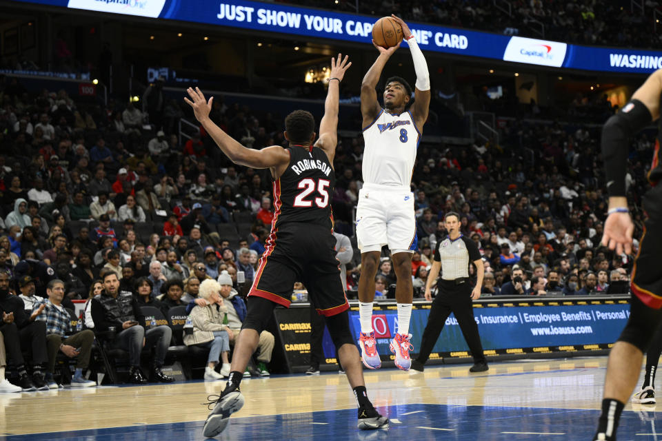 Washington Wizards forward Rui Hachimura (8) shoots against Miami Heat center Orlando Robinson (25) during the first half of an NBA basketball game Friday, Nov. 18, 2022, in Washington. (AP Photo/Nick Wass)