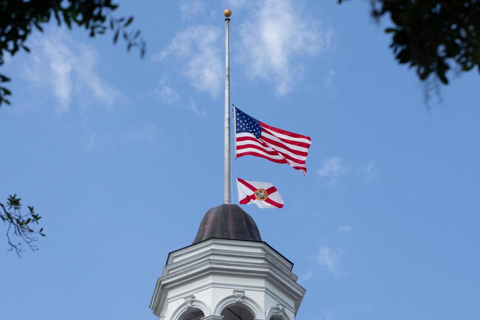 The U.S. and Florida flags fly at half-staff above the Florida Historic Capitol in June 2020 to honor the late former Senate President Gwen Margolis.