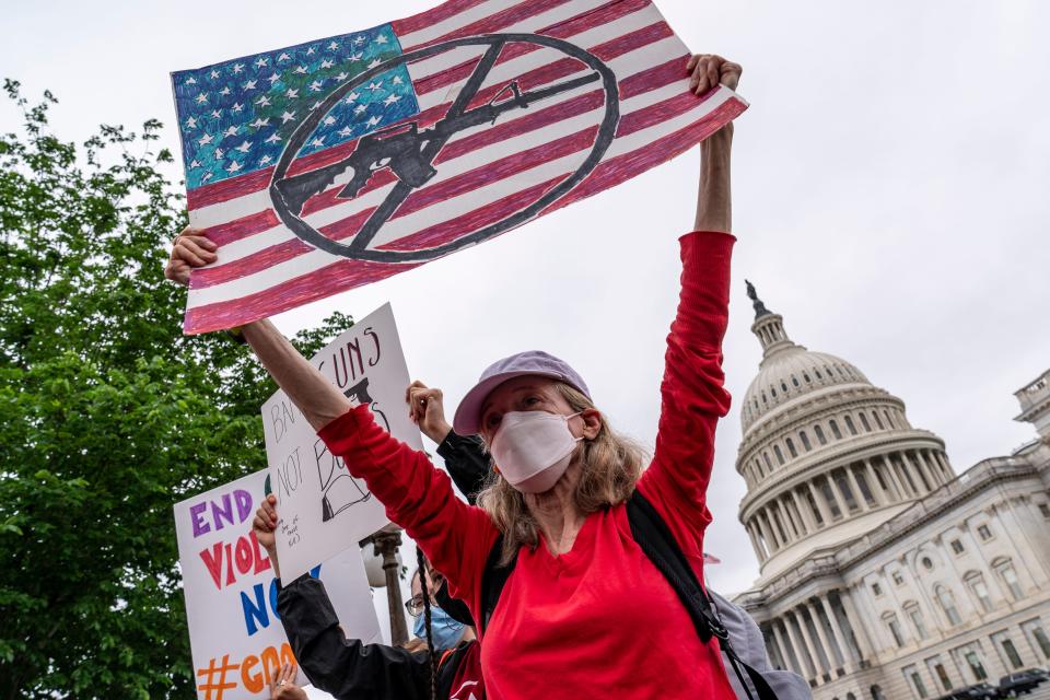 Activists join Senate Democrats outside the Capitol to demand action on gun control legislation after a gunman killed 19 children and two teachers at a Texas elementary school on Thursday, May 26, 2022.