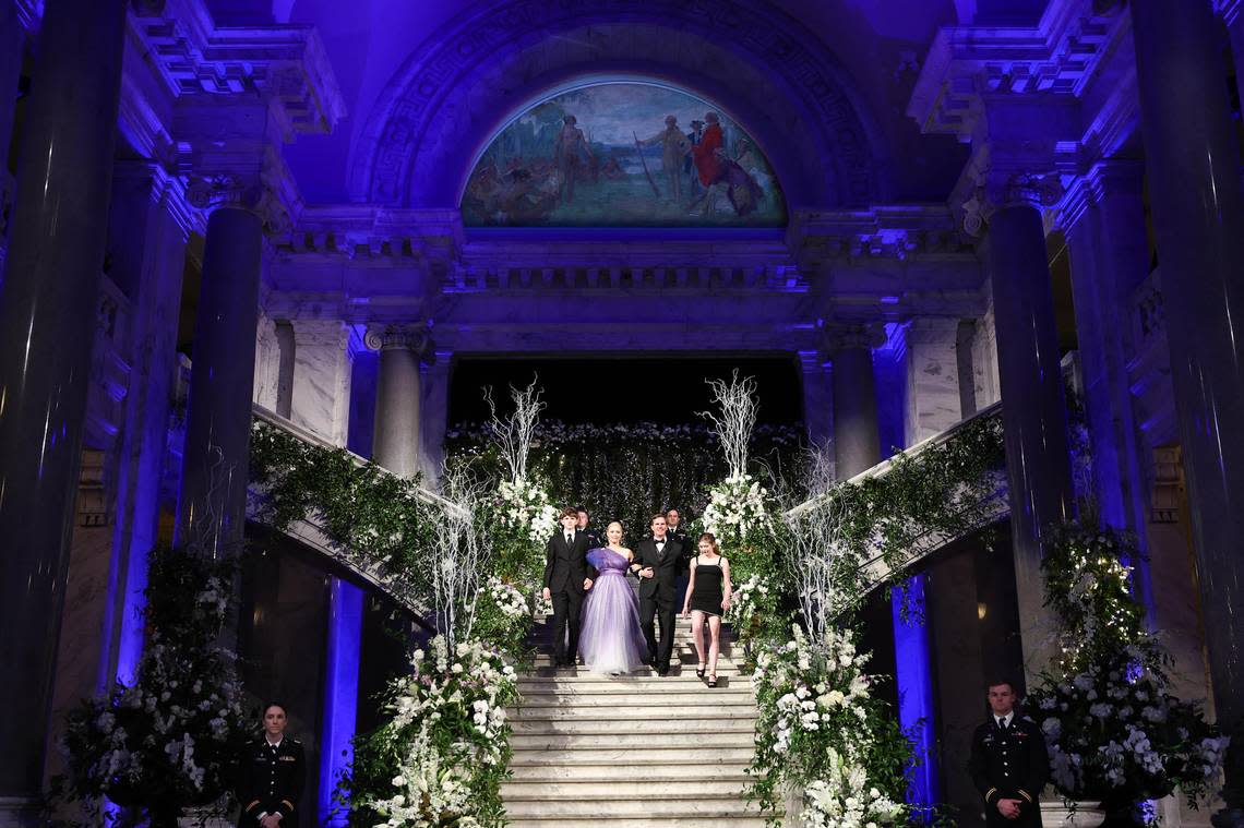 Gov. Andy Beshear and First Lady Britainy Beshear, with children Will, left, and Lila, right, attended the inaugural ball in the Capitol Rotunda Tuesday night.