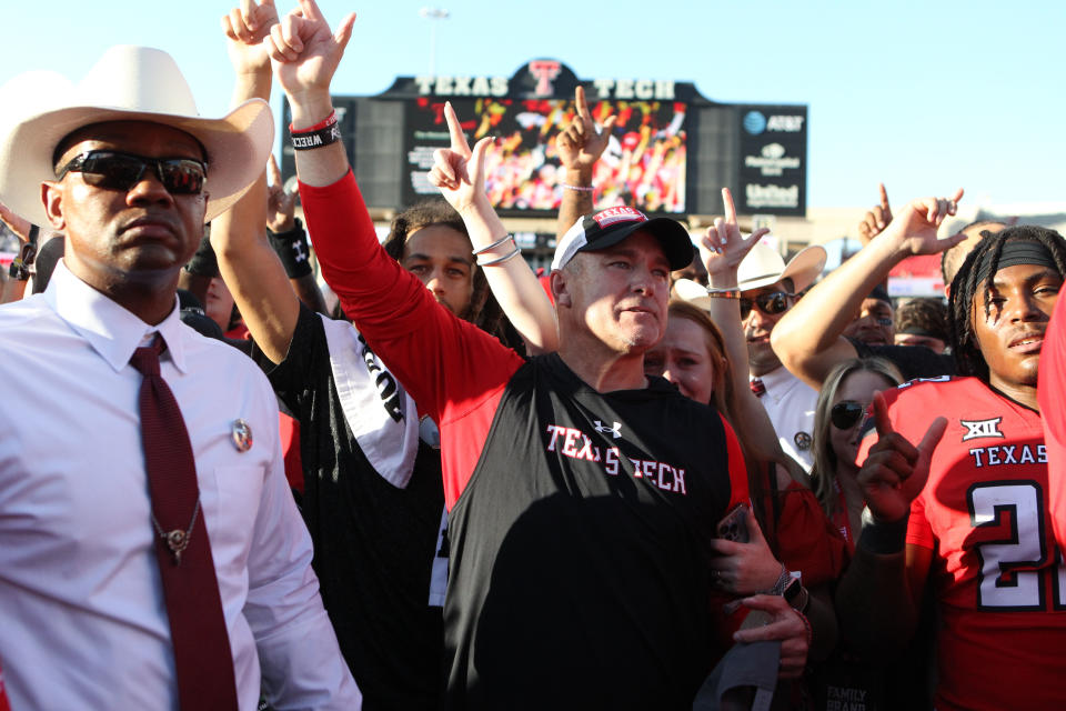 Sep 24, 2022; Lubbock, Texas, USA; Texas Tech Red Raiders head coach Joey McGuire sings the school song after the Red Raiders defeated the Texas Longhorns in overtime at Jones AT&T Stadium and <a class="link " href="https://sports.yahoo.com/ncaaf/players/345426" data-i13n="sec:content-canvas;subsec:anchor_text;elm:context_link" data-ylk="slk:Cody;sec:content-canvas;subsec:anchor_text;elm:context_link;itc:0">Cody</a> Campbell Field. Michael C. Johnson-USA TODAY Sports