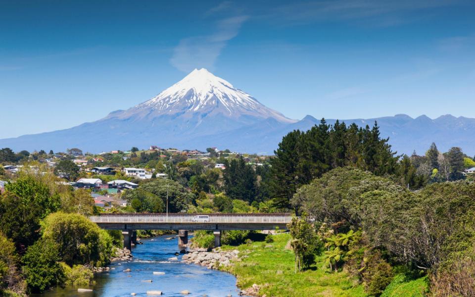 The Waiwhakaiho River, the city of New Plymouth, and Mount Taranaki, New Zealand - Credit: Alamy