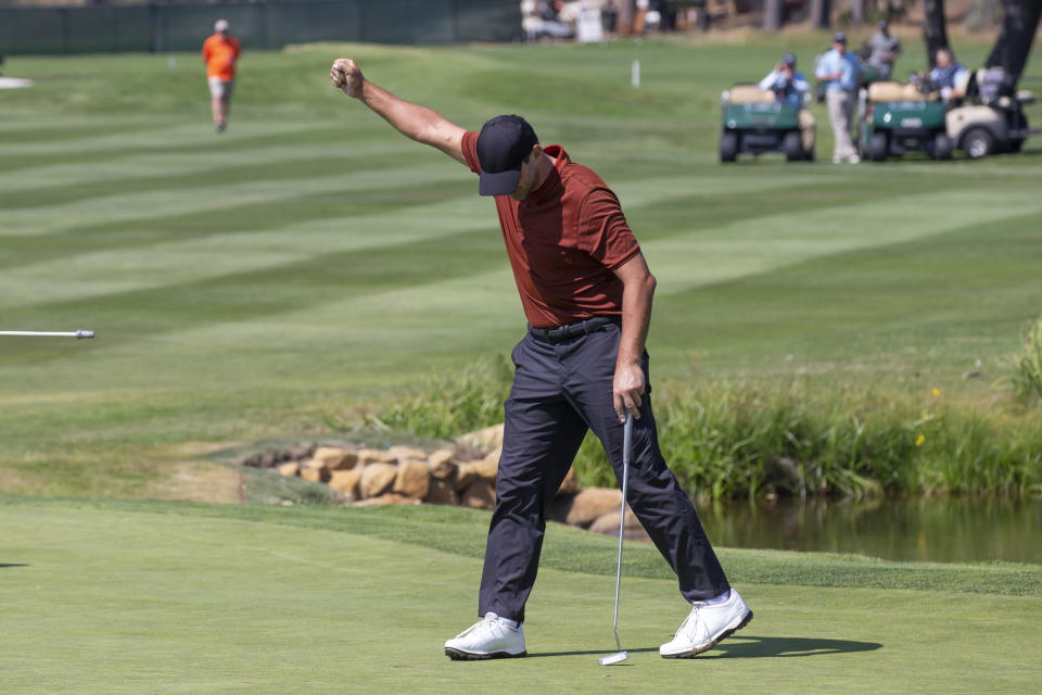 Tony Romo reacts after sinking the winning putt on the 18th hole during the final round of the American Century Celebrity Championship golf tournament at Edgewood Tahoe Golf Course in Stateline, Nev., Sunday, July 10, 2022. (AP Photo/Tom R. Smedes)