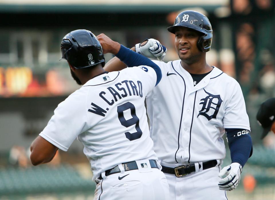 Tigers designated hitter Jonathan Schoop celebrates with center fielder Willi Castro after Schoop hit a two-run home run during the first inning of Game 2 of the doubleheader against the Twins on Tuesday, May 31, 2022, at Comerica Park.