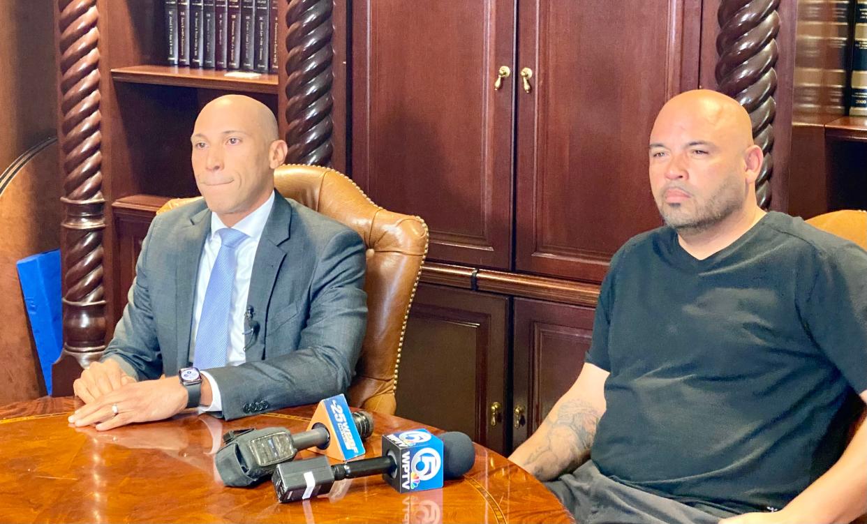 Attorney Nicholas Johnson (left) seated next to his client, Jose Rivera.