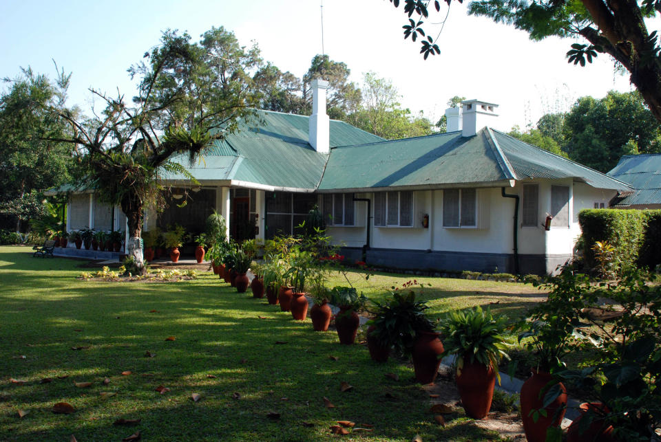 In this photo taken Dec. 5, 2012, a British Heritage Bungalow stands in Assam, now a luxury lodge, that once housed senior British tea estate managers, in Balipara, India. A number of tea estates in India and Sri Lanka have in recent years opened their doors to overnight guests, allowing them to enjoy the special estate lifestyle, learn about tea production and sample some great brews. (AP Photo/Denis Gray)