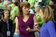 FILE - In this Sunday, March 5, 2017 photo, Debbie Antonelli, center, a women's college basketball analyst for ESPN, talks with play-by-play announcer Beth Mowins, right, before the start of the women's basketball game between Duke and Notre Dame at the NCAA college basketball game in the championship of the Atlantic Coast Conference tournament at the HTC Center in Conway, S.C., Sunday, March 5, 2017. Some of the giants of women’s basketball say if not for Title IX, doors would not have been open for them to blaze trails to Hall of Fame careers on and off the court, but sound complacency alarms when it comes to future of the law. (AP Photo/Mic Smith, File)
