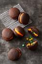 <p>Finding Halloween candy inside these scrumptious dessert sandwiches is almost as fun as trick-or-treating.</p><p>Get the <a href="https://www.goodhousekeeping.com/food-recipes/a28542085/stuffed-dark-chocolate-whoopie-pies-recipe/" rel="nofollow noopener" target="_blank" data-ylk="slk:Stuffed Dark Chocolate Whoopie Pies recipe;elm:context_link;itc:0;sec:content-canvas" class="link "><strong>Stuffed Dark Chocolate Whoopie Pies recipe</strong></a><em>.</em><em><br></em></p>