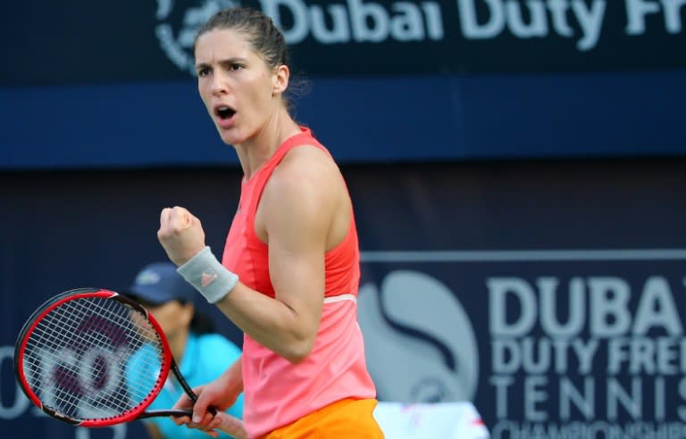 German Andrea Petkovic celebrates after winning a point against Italian Camila Giorgi at the Dubai Tennis Championships on February 15, 2016