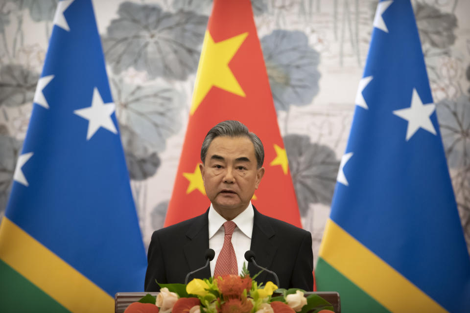 Chinese Foreign Minister Wang Yi talks during a ceremony to mark the establishment of diplomatic relations between the Solomon Islands and China at the Diaoyutai State Guesthouse in Beijing, Saturday, Sept. 21, 2019. (AP Photo/Mark Schiefelbein, Pool)