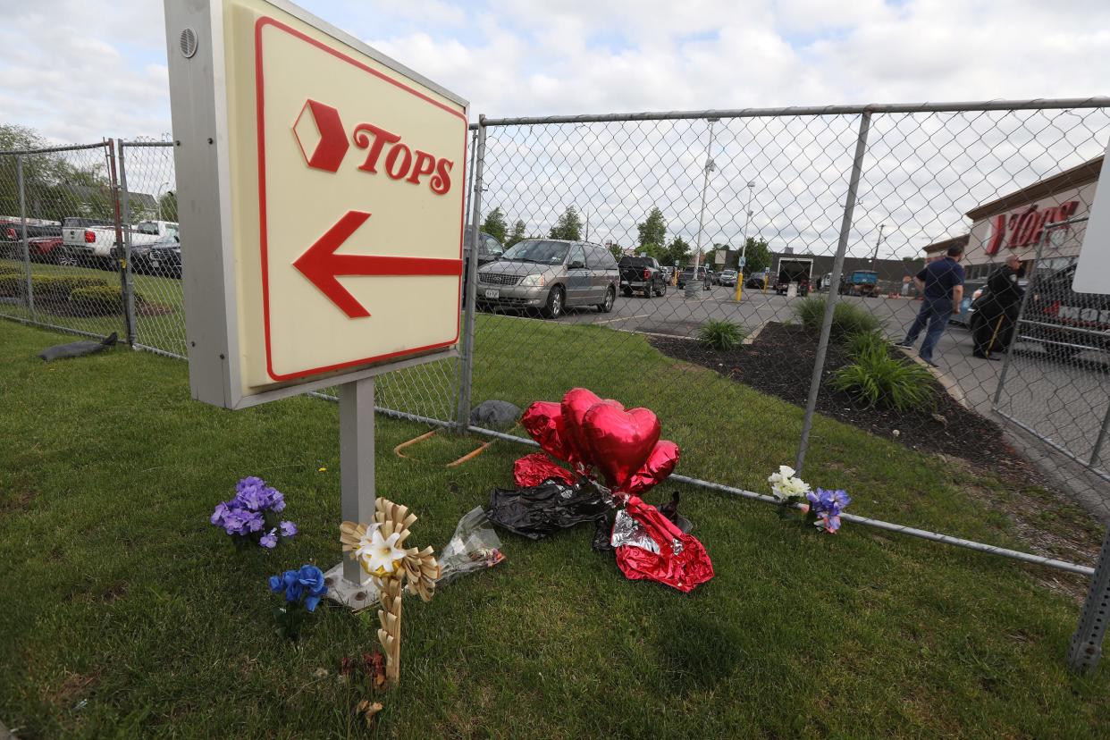 The plaza and surrounding streets are filled and going with memorials on May 25, 2022 for the people who were killed in a racially motivated shooting at Tops Friendly Market on Jefferson Ave. in Buffalo, NY on May 14.  Tops is busy with activity as it prepares to open at some point.  They did not want to give a timeline of when that would occur.