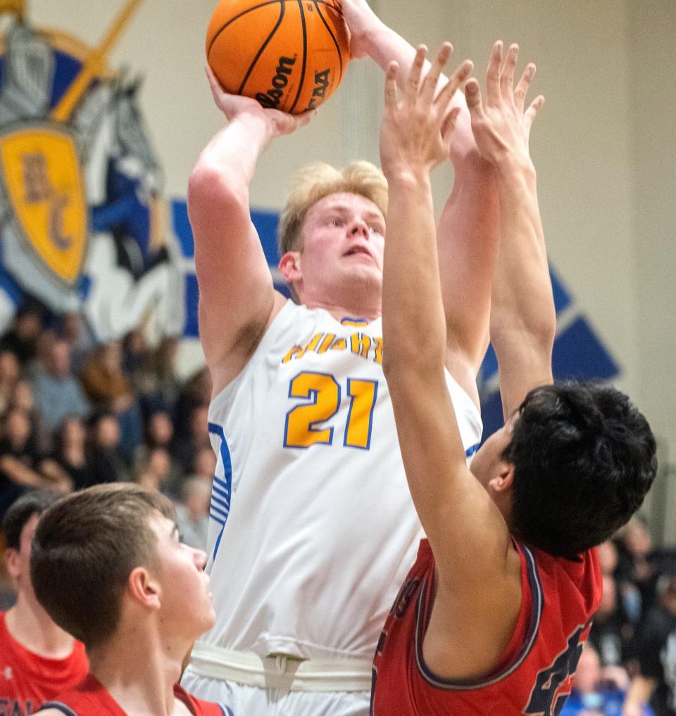 Ripon Christian's Thys Van Der Hoek, center, goes to the hoop against Vacaville Christian's  Steven Dingman, left, and Brian Laxamana during the Sac-Joaquin Section Division 5 boys basketball semifinal at Ripon Christian on Wednesday, Feb. 22, 2023.