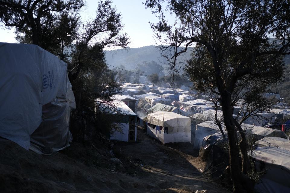 Tents placed by migrants are seen outside the Moria refugee camp on the northeastern Aegean island of Lesbos, Greece, on Wednesday, Jan. 22, 2020. Some businesses and public services on the eastern Aegean island are holding a 24-hour strike on Wednesday to protest the migration situation, with thousands of migrants and refugees are stranded in overcrowded camps in increasingly precarious conditions. (AP Photo/Aggelos Barai)