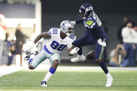 FILE PHOTO: Dec 24, 2017; Arlington, TX, USA; Dallas Cowboys wide receiver Dez Bryant (88) fumbles the ball after being hit by Seattle Seahawks cornerback Byron Maxwell (41) in the second quarter at AT&T Stadium. Tim Heitman-USA TODAY Sports