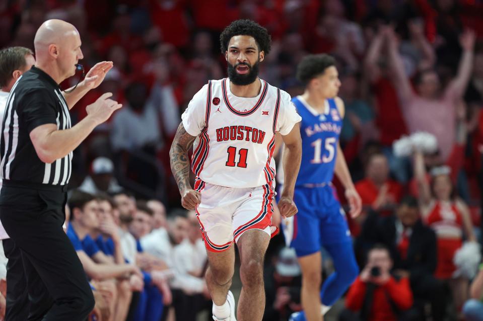 Houston guard Damian Dunn (11) reacts after scoring a basket during the first half against the Kansas at Fertitta Center.