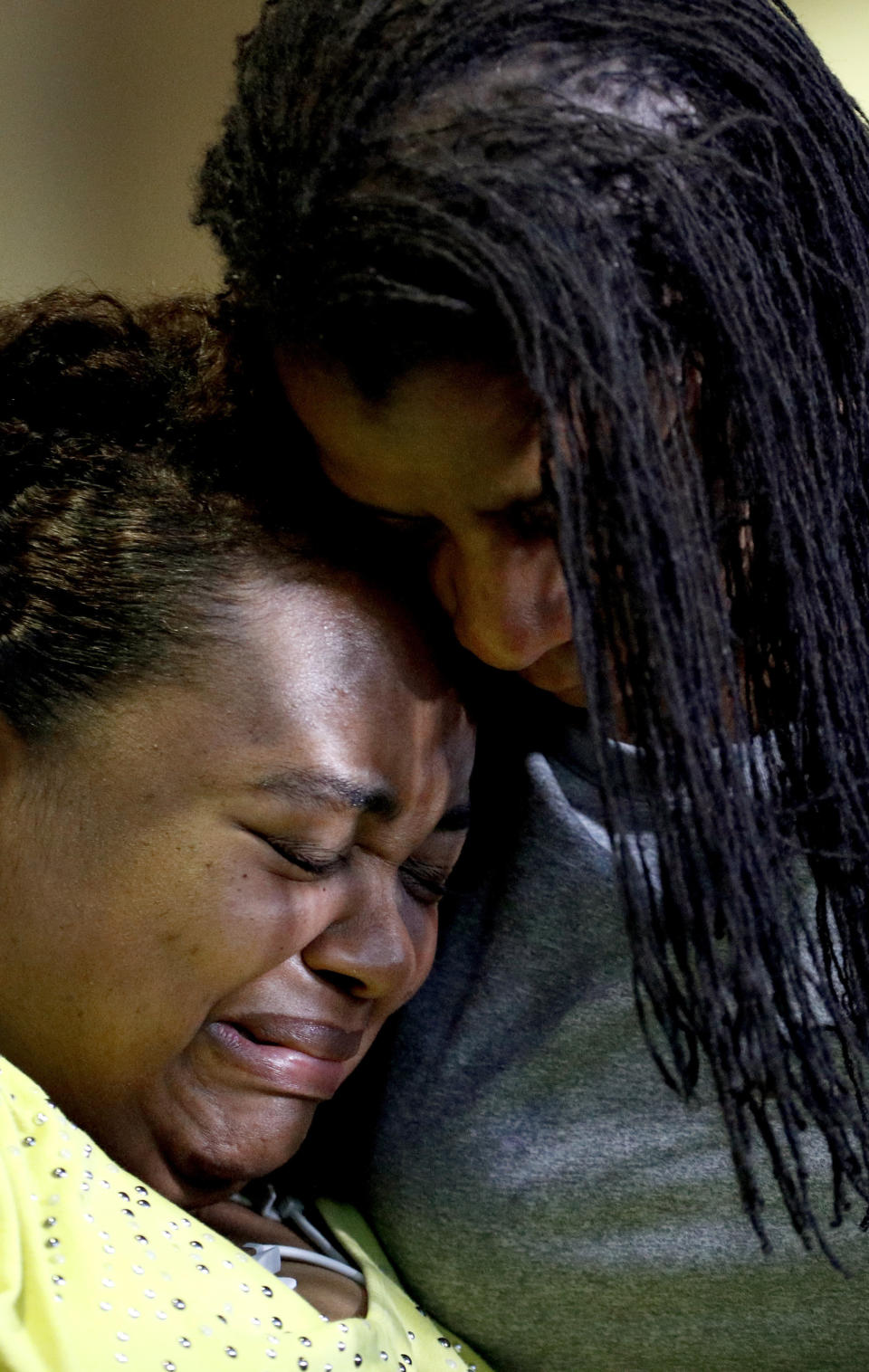 Duck boat accident survivor Tia Coleman is comforted by her sister Leeta Bigbee after speaking to the media at Cox Medical Center Branson Saturday, July 21, 2018 in Branson, Mo. Coleman lost nine family members in the accident Thursday on Table Rock Lake which left over a dozen people dead. (AP Photo/Charlie Riedel)