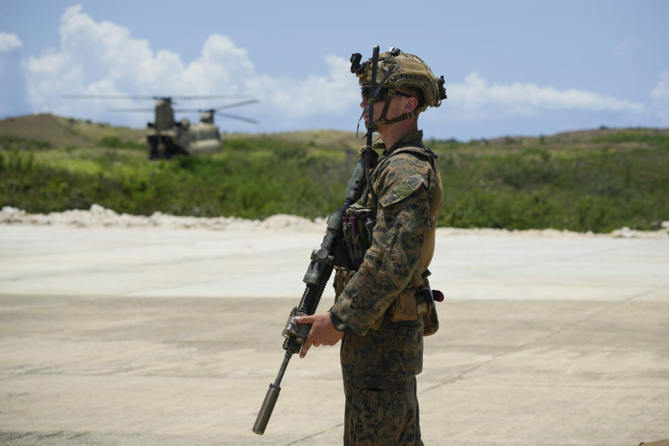 U.S. marines secure an area at the airport of the Philippines' northernmost town of Itbayat, Batanes province during a joint military exercise on Monday, May 6, 2024. American and Filipino marines held annual combat-readiness exercises called Balikatan, Tagalog for shoulder-to-shoulder, in a show of allied military readiness in the Philippines' northernmost town facing southern Taiwan. (AP Photo/Aaron Favila)