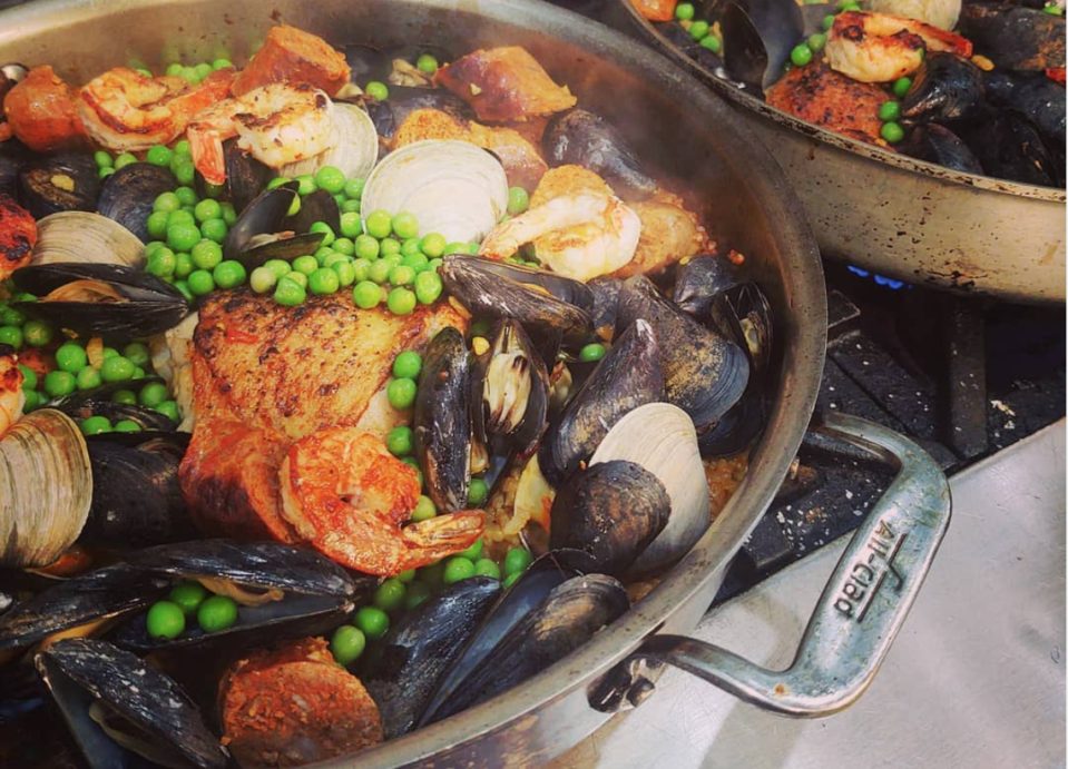 Guests at The Foodie School create dishes while being led by chefs.