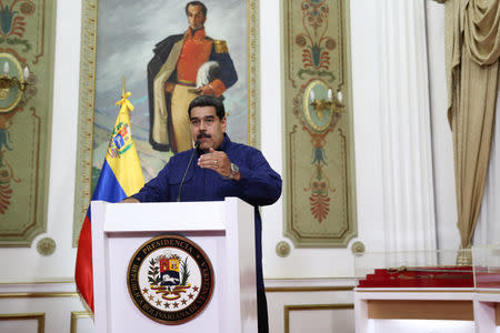 Venezuela's President Nicolas Maduro speaks during a broadcast at Miraflores Palace in Caracas, Venezuela March 11, 2019. Miraflores Palace/Handout via REUTERS