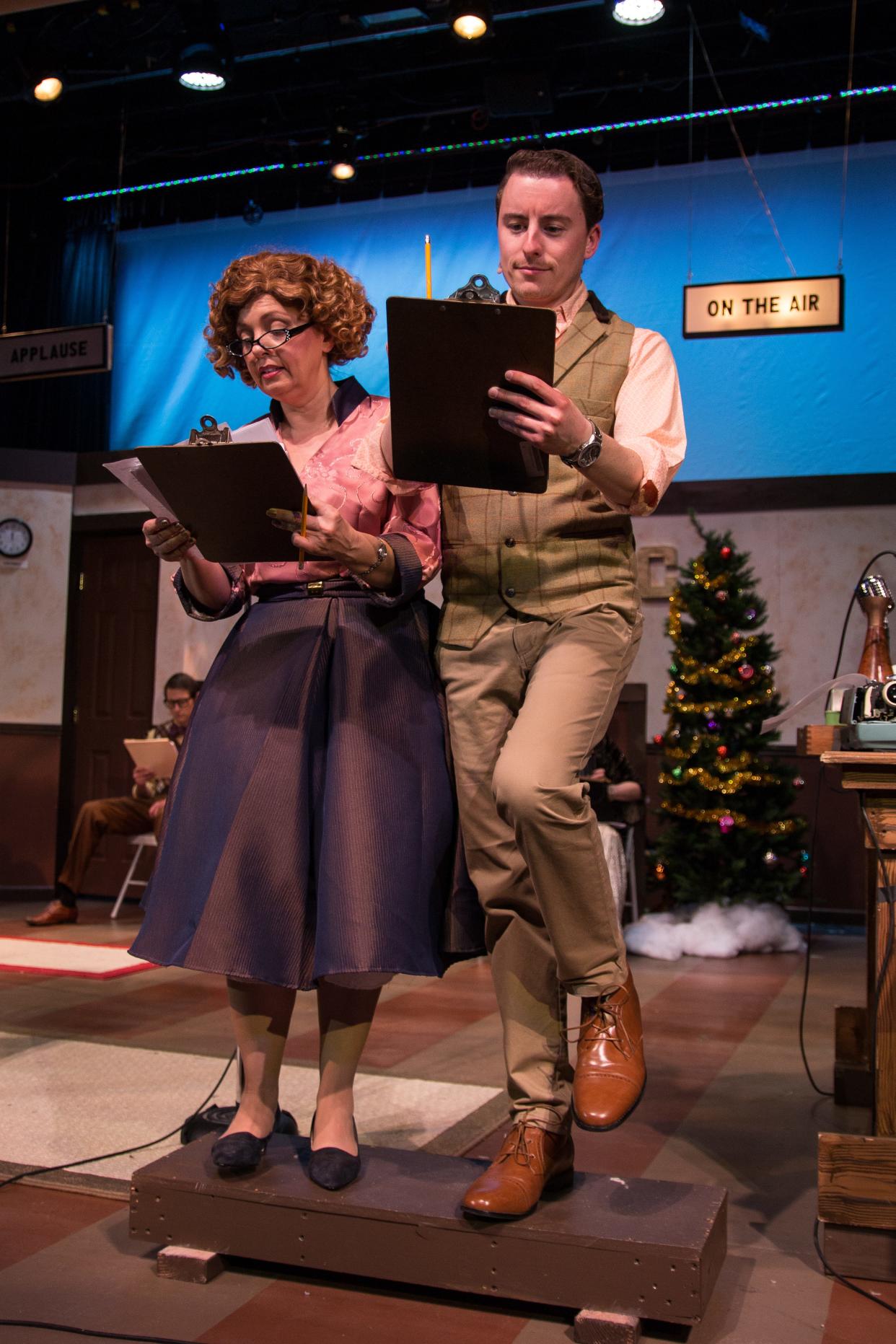 Stage manager Gladys Murphy, portrayed by Sharon Gibson, and station manager Gordon Fitzgerald, played by Kyle Cooknick, do their bit to save WNBC radio’s annual Christmas Eve broadcast during “It’s a Wonderful Life: On Air." The play runs Dec. 1-23 at the Simi Valley Cultural Arts Center.