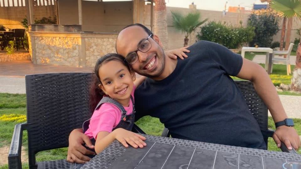 Ella Mohammed Hamouda (left) and her father, Mohammed Hamouda (right) sit at a beachside restaurant in Beit Lahia, in northern Gaza, on June 26, 2023. - Mohammed Hamouda