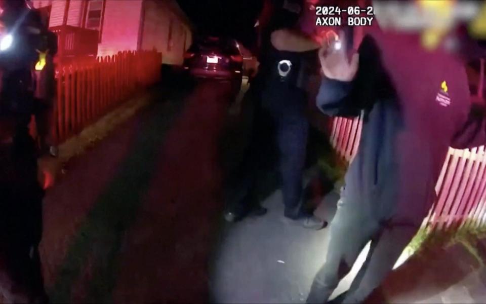 A still from the bodycam footage shows officers with one of the teenagers