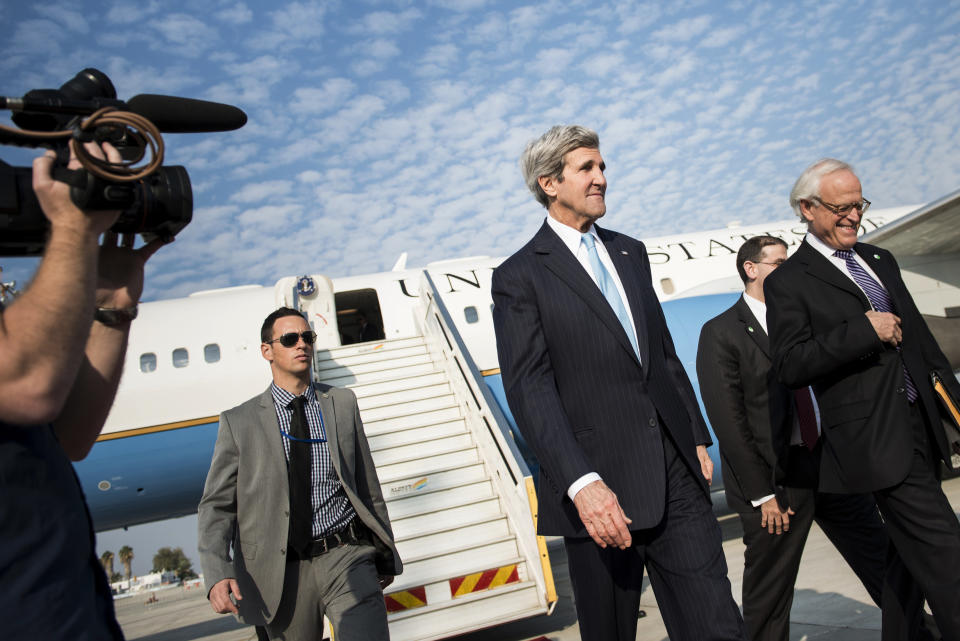 U.S. Secretary of State John Kerry arrives at Ben Gurion airport near Tel Aviv, Israel, Thursday, Jan. 2, 2014. Kerry arrived Thursday in Israel to broker Mideast peace talks that are entering a difficult phase aimed at reaching a two-state solution between the Israelis and Palestinians. (AP Photo/Brendan Smialowski, Pool)