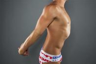 Water polo player Tony Azevedo stretches while posing for a portrait during the 2012 U.S. Olympic Team Media Summit in Dallas, May 15, 2012.