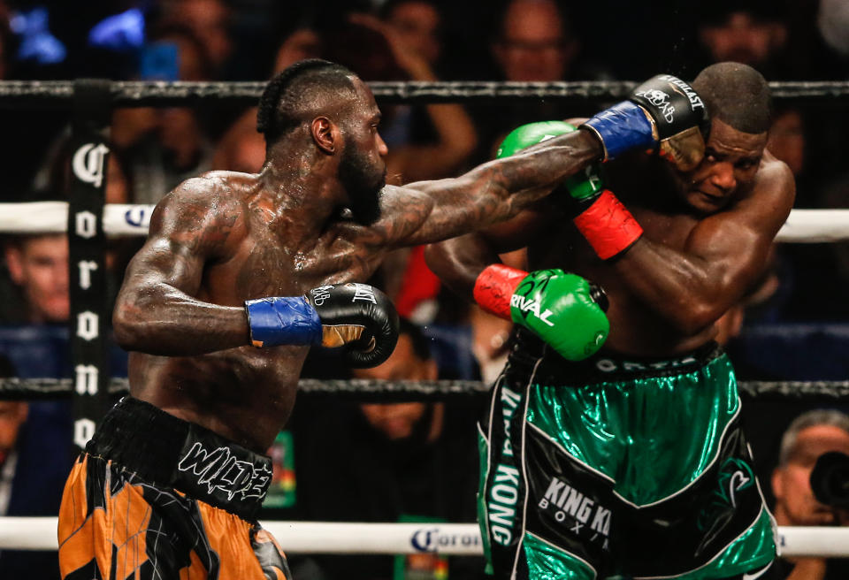 WBC heavyweight champion Deontay Wilder (L) lands a jab on Luis Ortiz Saturday at the Barclays Center in Brooklyn en route to a 10th round KO in a thrilling fight. (Getty Images)