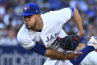 Toronto Blue Jays starting pitcher Jose Berrios throws to a Cleveland Guardians batter during the first inning of a baseball game Friday, Aug. 12, 2022, in Toronto. (Jon Blacker/The Canadian Press via AP)