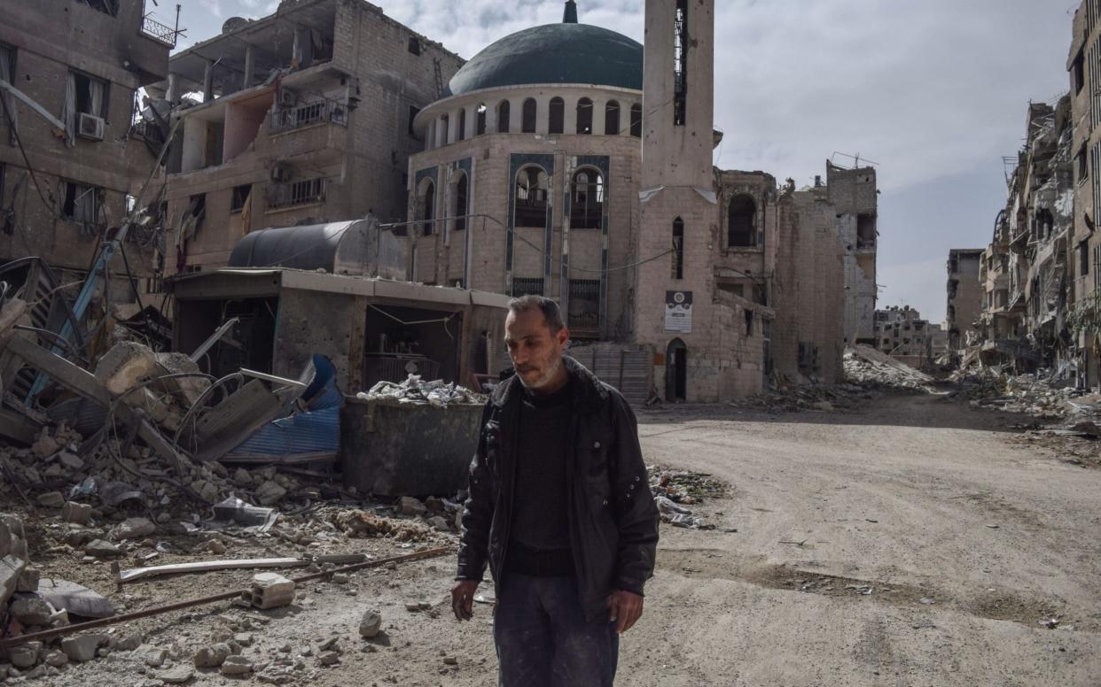 Abu Gassan, muezzin of the Huzaifa Mosque in Eastern Ghouta, which was destroyed during the airstrikes  - Anadolu
