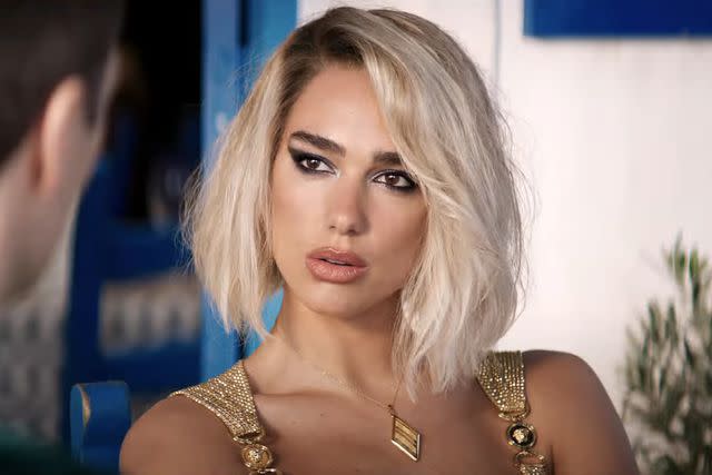 Dua Lipa Shines as Golden Seductress in First Trailer for Spy Thriller ...