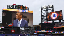 Former New York Mets pitcher Dwight Gooden appears on the scoreboard before a ceremony to retire his No. 16 at Citi Field before a baseball game between the Mets and the Kansas City Royals, Sunday, April 14, 2024, in New York. (AP Photo/Noah K. Murray)