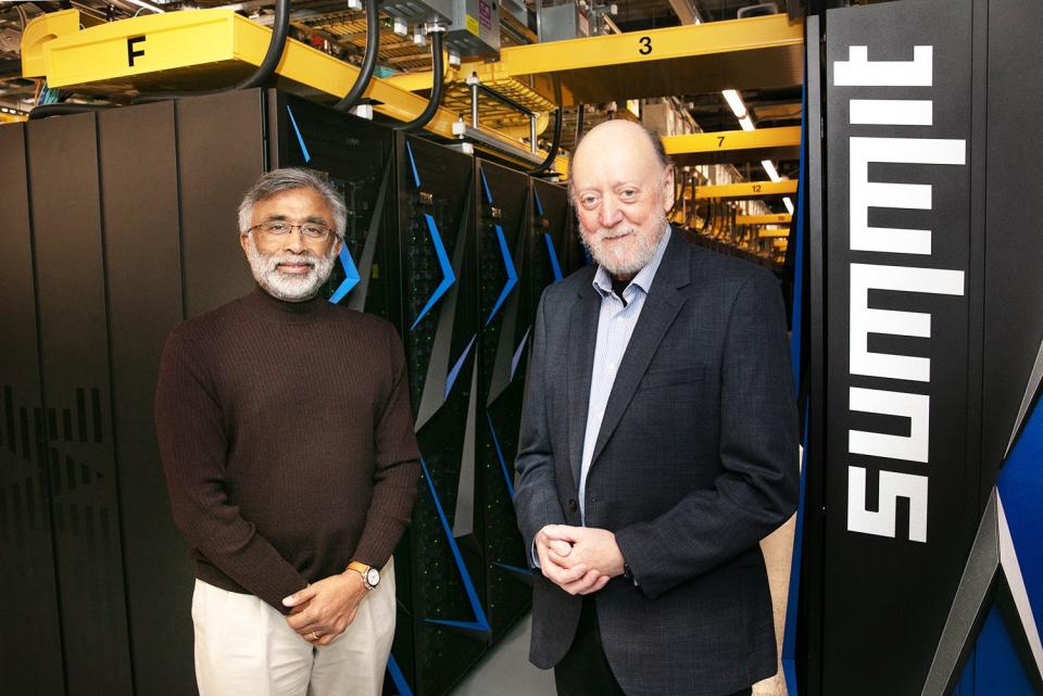 Jack Dongarra, right, is congratulated by Oak Ridge National Laboratory Director Thomas Zacharia for winning the Turing Award. The Summit supercomputer at ORNL is the backdrop. In 2021, Summit was ranked the fastest supercomputer in the United States and the second fastest in the world.