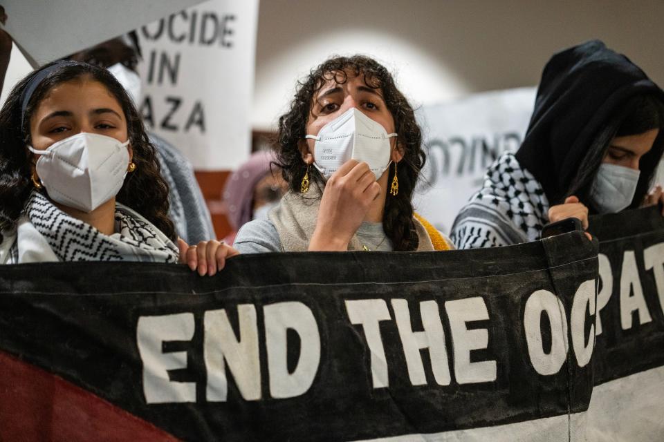 Students and community members chant during a meeting of the OSU trustees at The Ohio State University Longaberger Alumni House on Thursday. The protesters called on university trustees to divest from corporations they say support Israeli and fossil fuel companies.