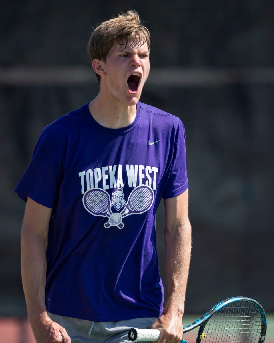 Topeka West Miles Cusick reacts after beating Salina Central Saturday at Kossover Tennis Court.