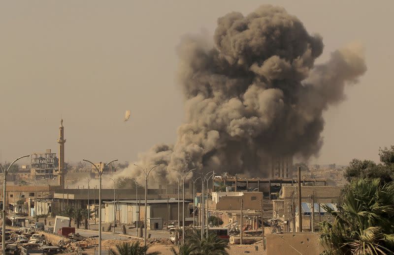 FILE PHOTO: Smoke rises after an air strike during fighting between members of the Syrian Democratic Forces and Islamic State militants in Raqqa