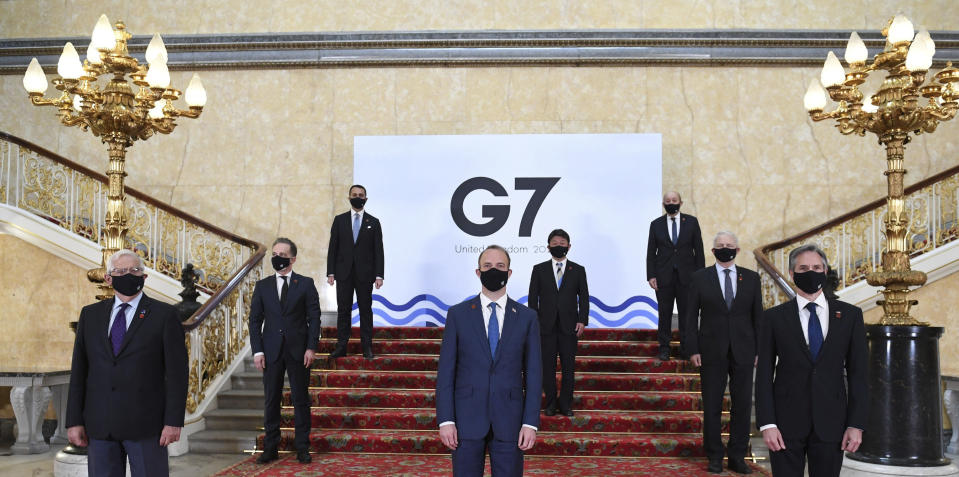 G7 foreign ministers wear face masks and are socially distanced for a group photo, with front row left, European High Representative of the Union for Foreign Affairs Josep Borrell, British Foreign Secretary Dominic Raab, U.S. Secretary of State Antony Blinken, middle row left to right, German Federal Minister for Foreign Affairs Heiko Maas, Japanese Minister of Foreign Affairs Motegi Toshimitsu and Canadian Minister of Foreign Affairs Marc Garneau, back row from left, Italian Minister of Foreign Affairs Luigi Di Maio and French Minister of Europe and Foreign Affairs Jean-Yves Le Drian, on the stairs at Lancaster House in London ahead of bilateral talks at the G7 Foreign and Development Ministers meeting in London, Tuesday May 4, 2021.(Stefan Rousseau/Pool via AP)