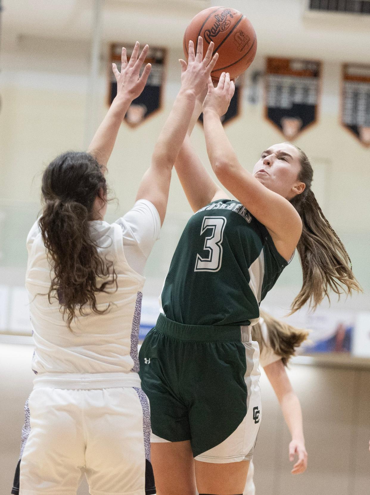 Central Catholic's Sarah Belden shoots over defense from Jackson's Presley Trbovich in the first half of Wednesday's game.