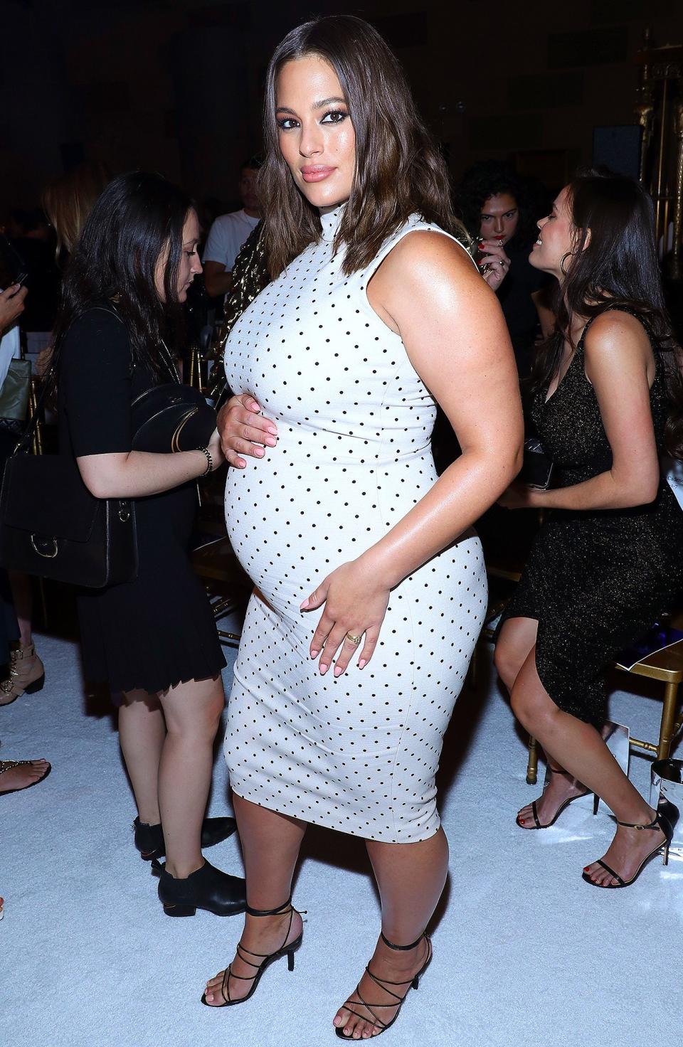 The model posed in a white polka dot dress at the Christian Siriano show. 